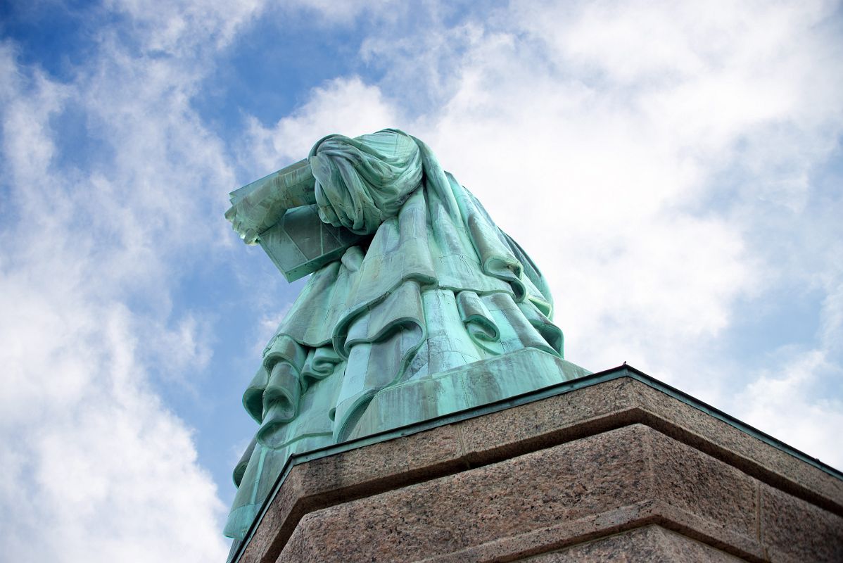 07-02 Statue Of Liberty Side View Holding Book From Pedestal